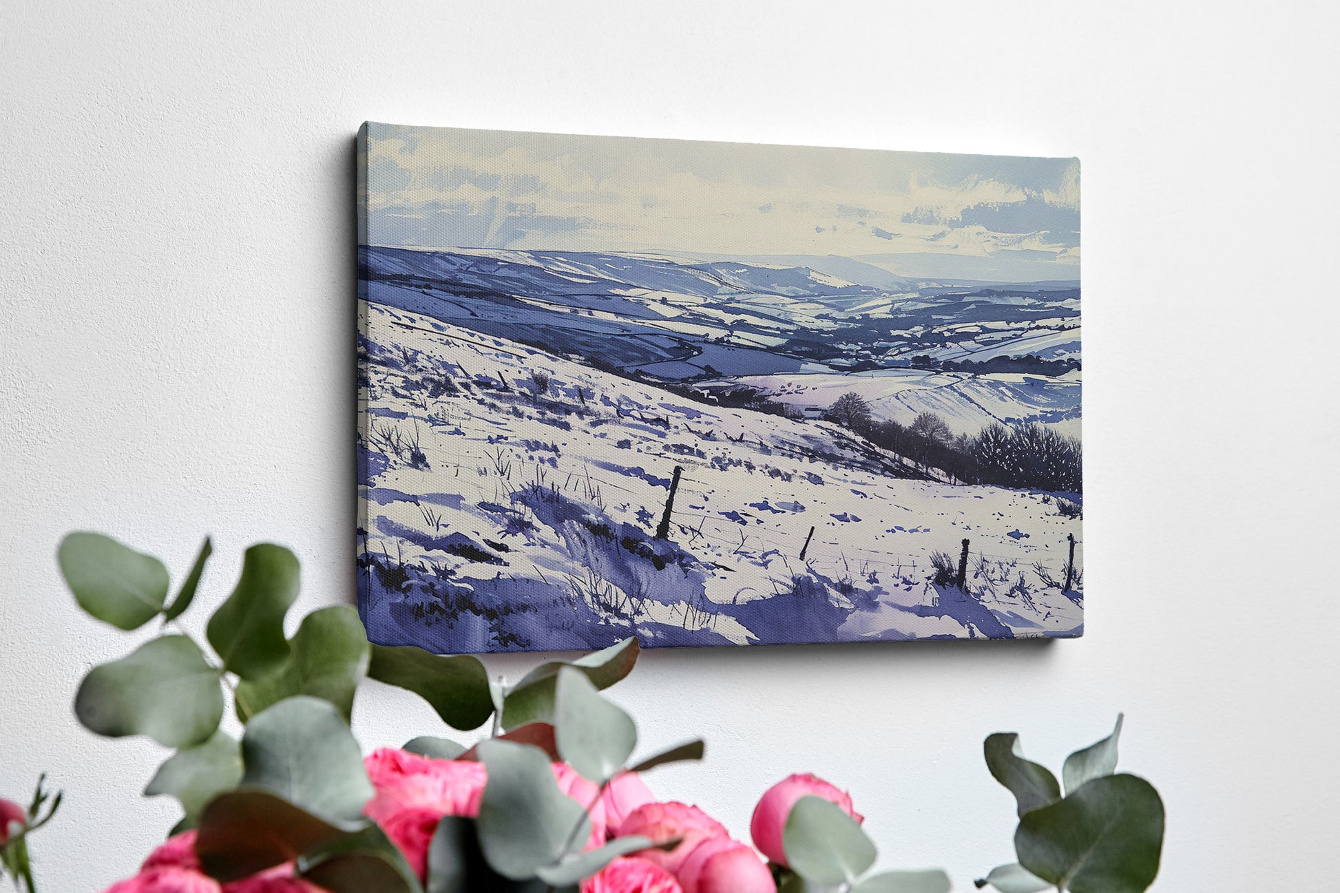 Framed canvas print of a snowy countryside landscape with rolling hills in cool blue tones