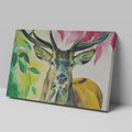 Framed canvas print of a colourful, modern artistic depiction of a stag with vibrant hues.