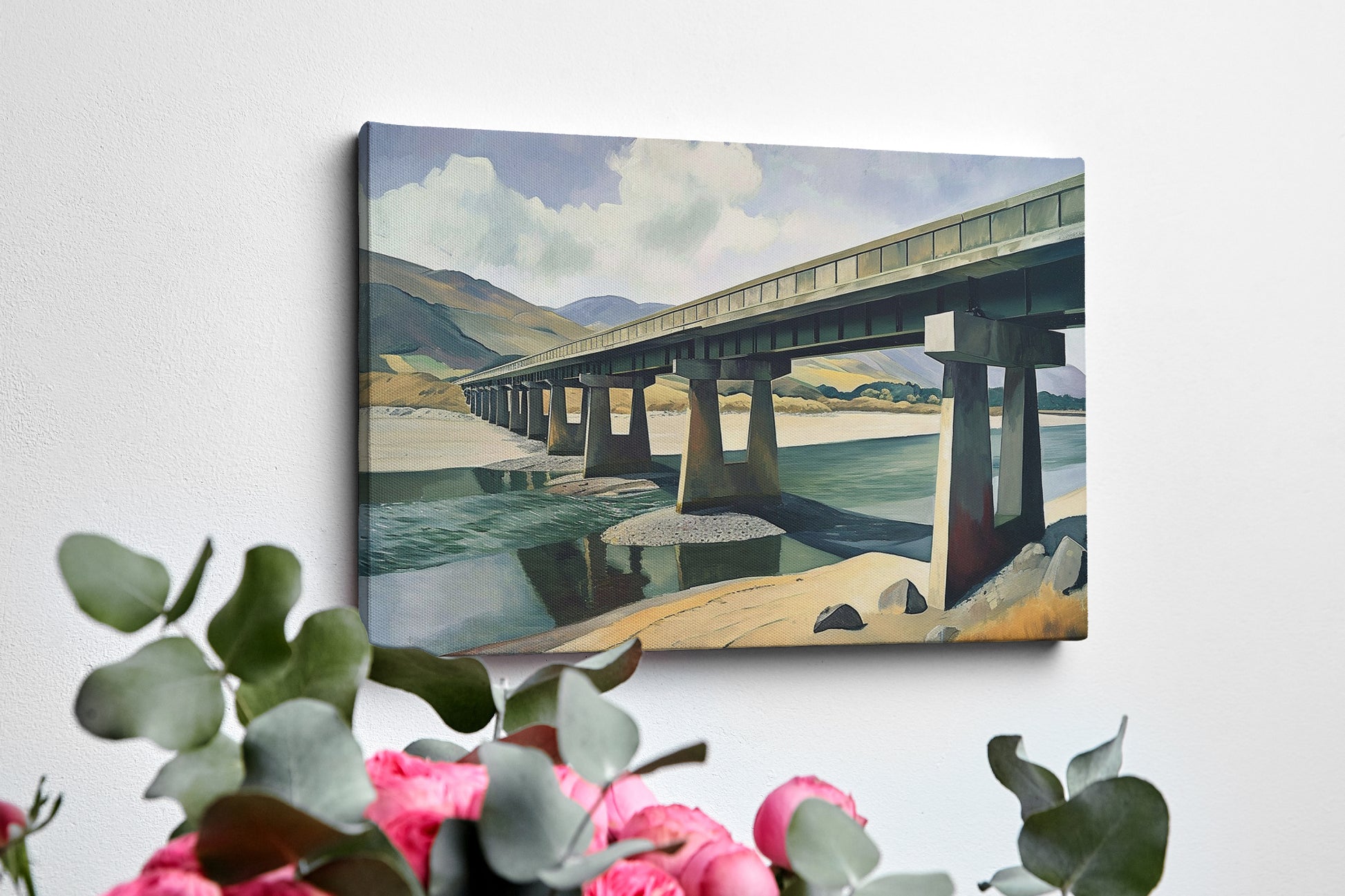 Framed canvas print of a serene countryside bridge over a river with mountain backdrop