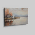 Framed canvas print of an impressionist painting with a sailing boat and autumn trees by a lake