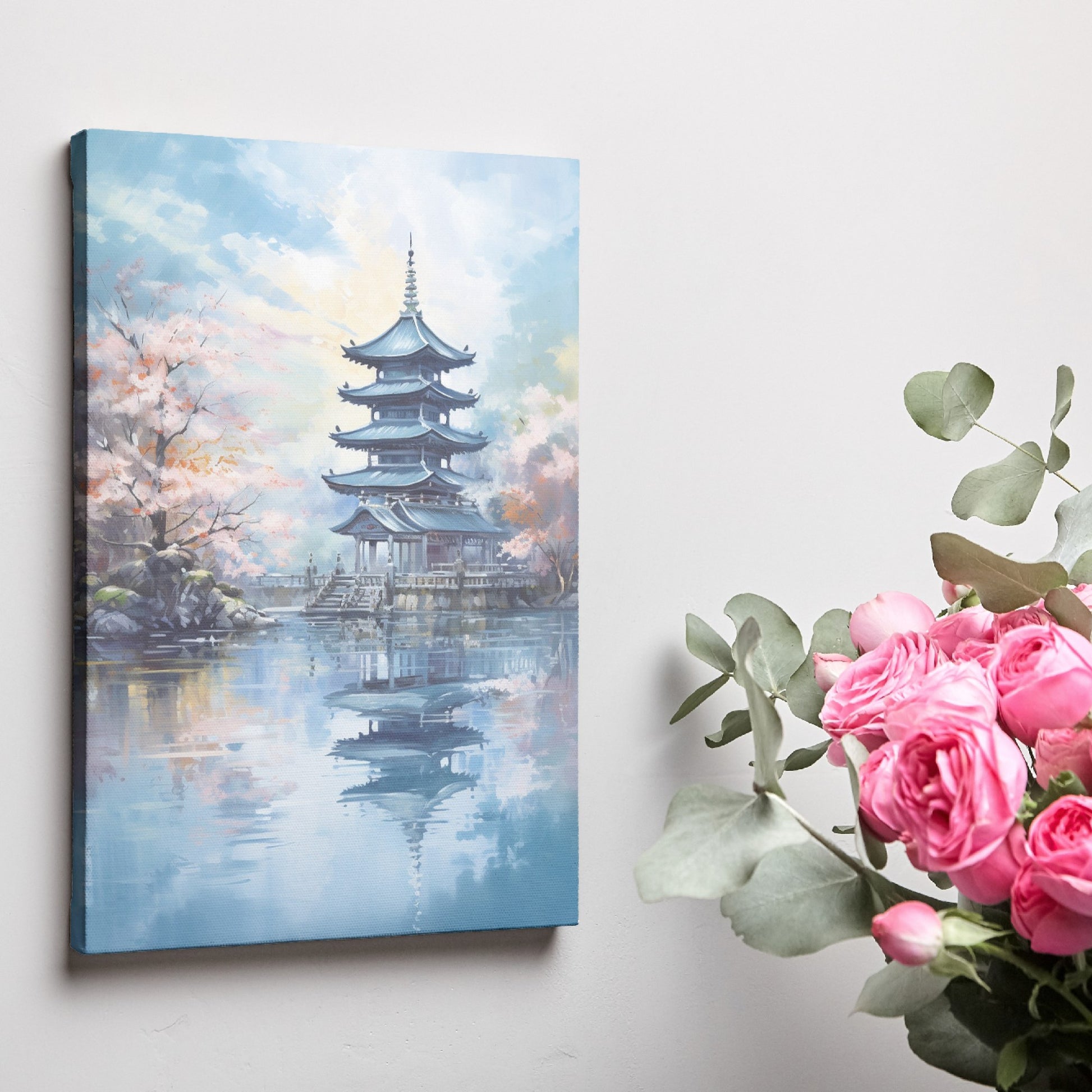 Framed canvas print of a traditional Japanese pagoda and cherry blossoms beside a reflective lake