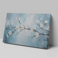 Framed canvas print of serene cherry blossoms with impasto texture on blue background