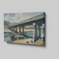 Framed canvas print of a serene countryside bridge over a river with mountain backdrop