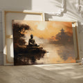 Framed canvas print of a serene Buddha statue at sunset with oriental temple and reflective water