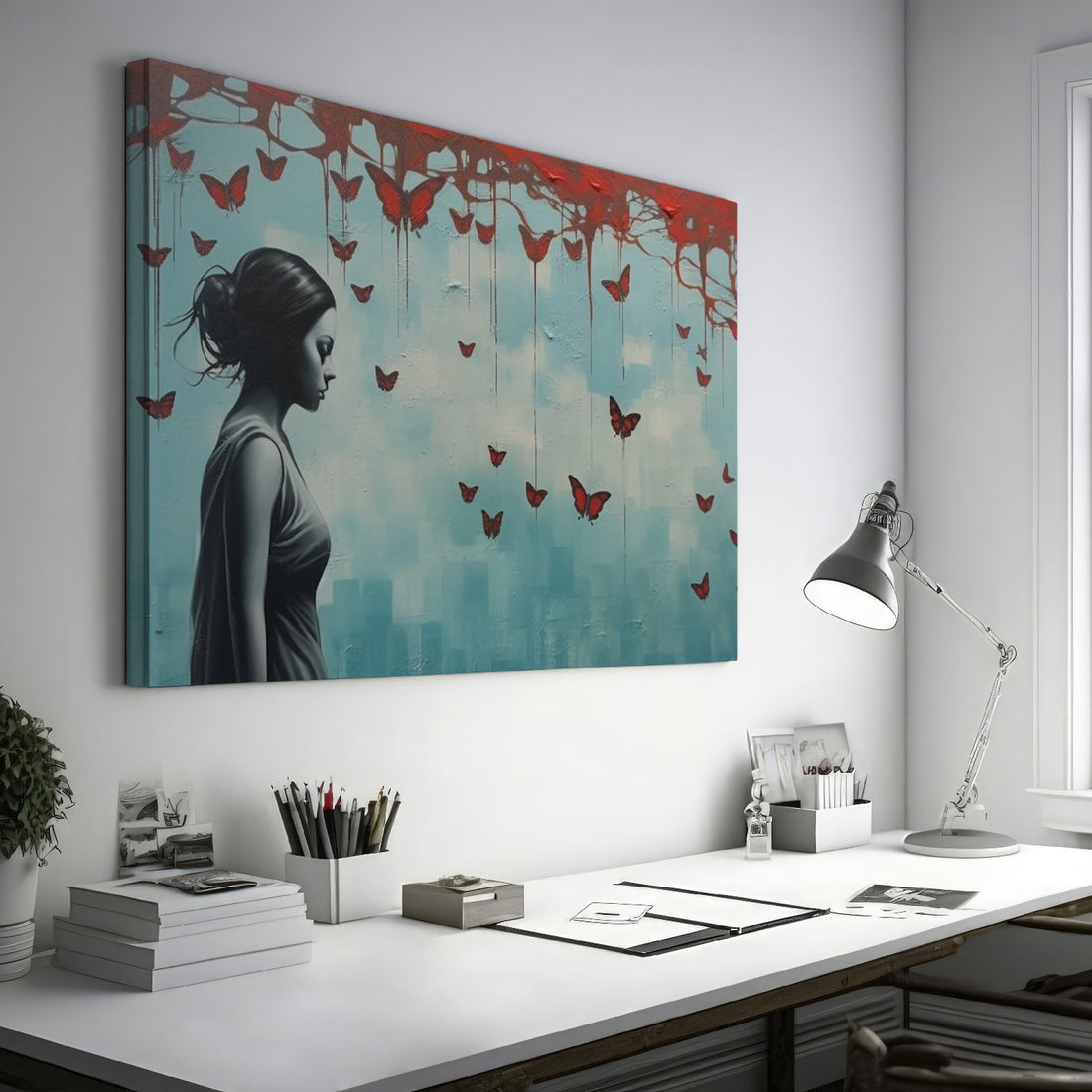 Framed canvas print of a female silhouette with red butterflies against an urban backdrop