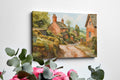 Framed canvas print of a charming English village scene with watercolour cottages in a rustic countryside setting