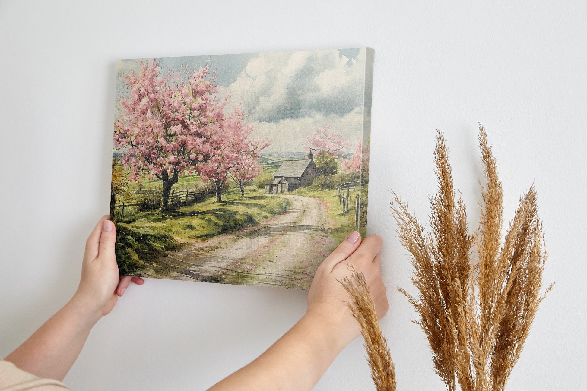 Framed canvas print of a picturesque countryside with cherry blossoms and a farmhouse