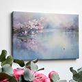 Framed canvas print of cherry blossoms over a tranquil lake with soft pastel colours and a pair of ducks