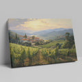 Framed canvas print of a Tuscan vineyard at sunset with warm golden hues and terracotta houses