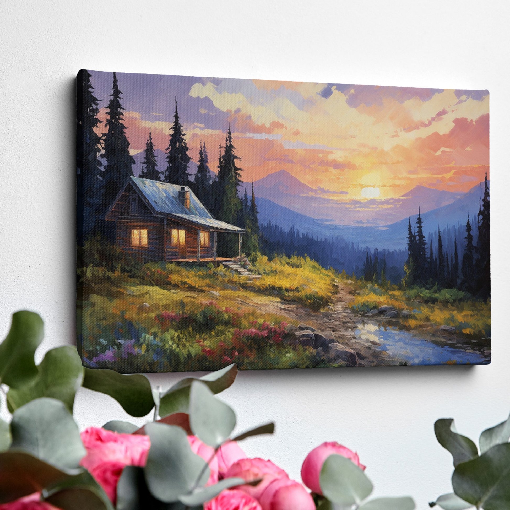 Framed canvas print of a rustic cabin at sunset with a mountainous backdrop