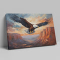 Framed canvas print of a majestic eagle soaring over a canyon at sunset