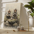 Framed canvas print of two realistic macaques with serene expressions sitting by a water pot