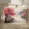 Framed canvas print of a watercolour cherry blossom landscape with figures and traditional architecture