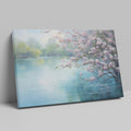 Framed canvas print of Cherry Blossoms by a Tranquil Lake with Pastel Colours