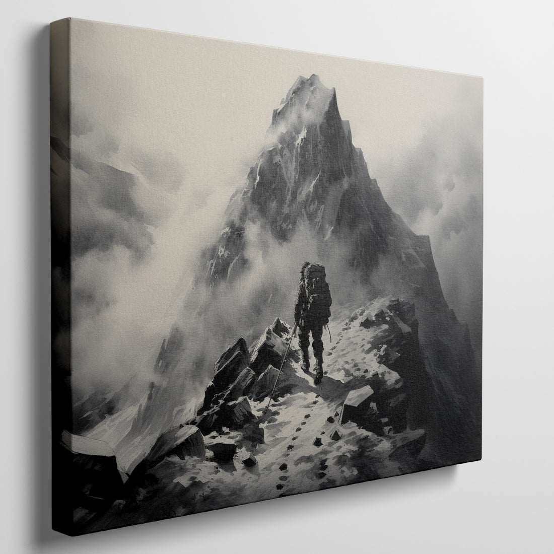 Framed canvas print of a lone mountaineer making their way up a foggy, monochromatic mountain scene