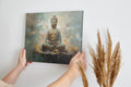 Framed canvas print of serene Buddha in meditation with abstract blue and orange background