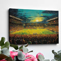 Framed canvas print of an impressionist painting capturing a football match at sunset with a cheering crowd