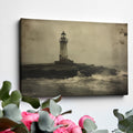 Framed canvas print of a vintage-style lighthouse on a stormy shore in sepia tones