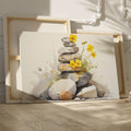 Framed canvas print of Zen stones balanced in watercolour with yellow flowers