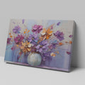 Framed canvas print of a bold textured floral painting with vibrant purple, blue, and orange flowers in an abstract vase