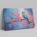 Framed canvas print of a bluebird perched on cherry blossom branches, with vibrant blue and pink hues