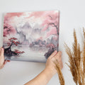 Framed canvas print of Asian landscape with cherry blossoms and misty mountains