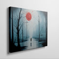 Framed canvas print of a mysterious blue forest with a vibrant red moon and a lone silhouette reflected on the water