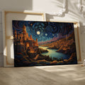 Framed canvas print of a moonlit fantasy cityscape with vibrant colours and a starry night sky