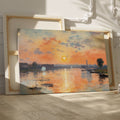 Framed canvas print of impressionist river landscape at sunset with vibrant orange and blue hues