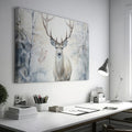 Framed canvas print of a majestic stag set against a snowy forest backdrop with soft beige and white tones