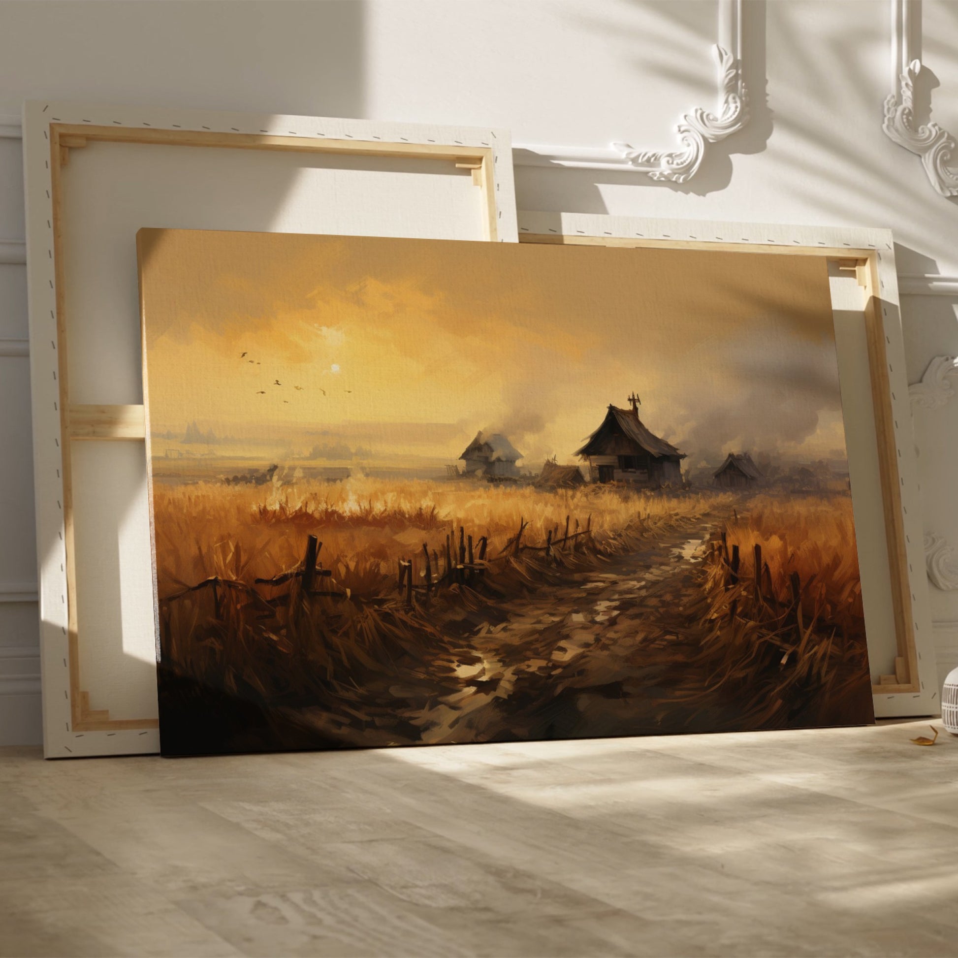 Framed canvas print of a rustic countryside at sunset with golden fields and cottages