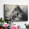 Framed canvas print of a lone mountaineer making their way up a foggy, monochromatic mountain scene