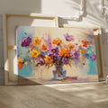 Framed canvas print of lively impressionist floral bouquet with vibrant purples, oranges, and yellows