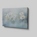 Framed canvas print of serene watercolor flowers with soft blue hues and water reflections