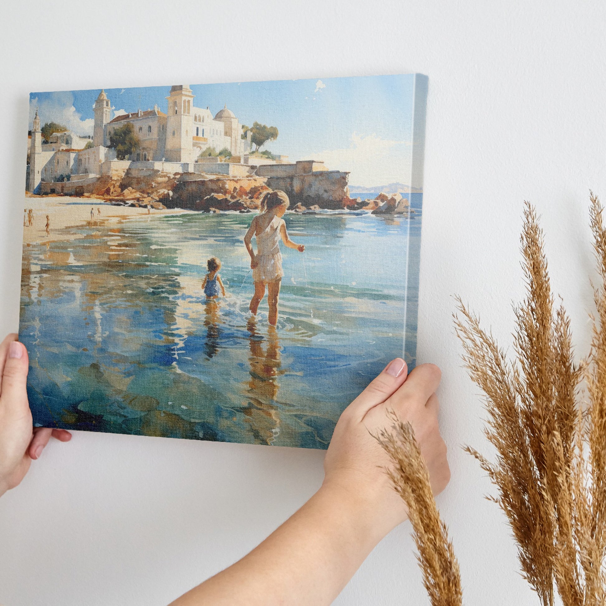 Framed canvas print of a sunlit Mediterranean beach with a mother and child