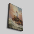 Framed canvas print of a clifftop lighthouse overlooking turbulent sea waves, under a light-infused sunset sky