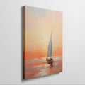 Framed canvas print of impressionistic sailboat at sunset with warm golden and orange tones