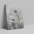 Framed canvas print of monochrome flowers with water droplets