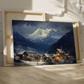 Framed canvas print of a snowy Alpine village with mountain backdrop and evening glow