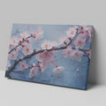 Framed canvas print of cherry blossoms with rain droplets on blue background