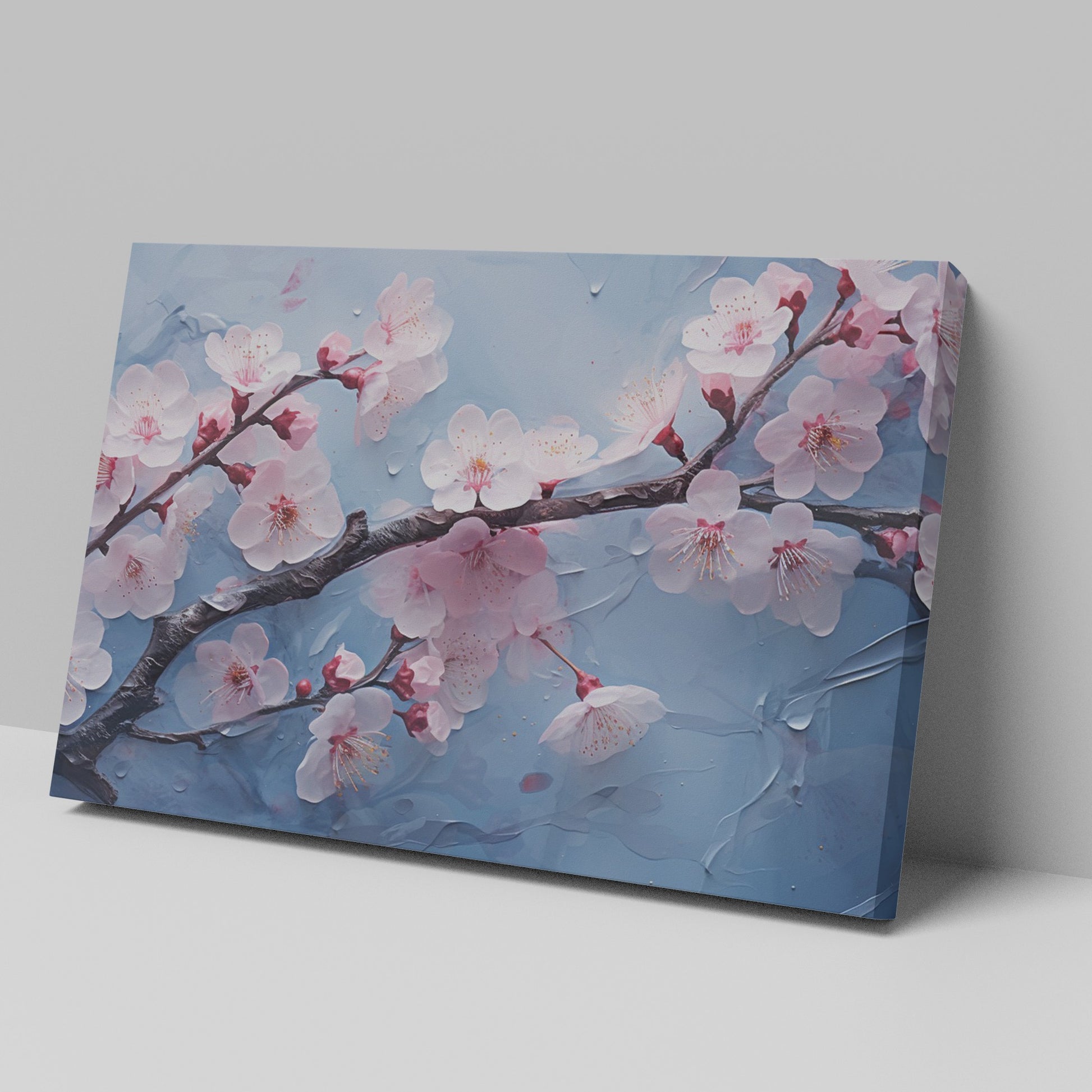 Framed canvas print of cherry blossoms with rain droplets on blue background