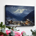 Framed canvas print of a snowy Alpine village with mountain backdrop and evening glow