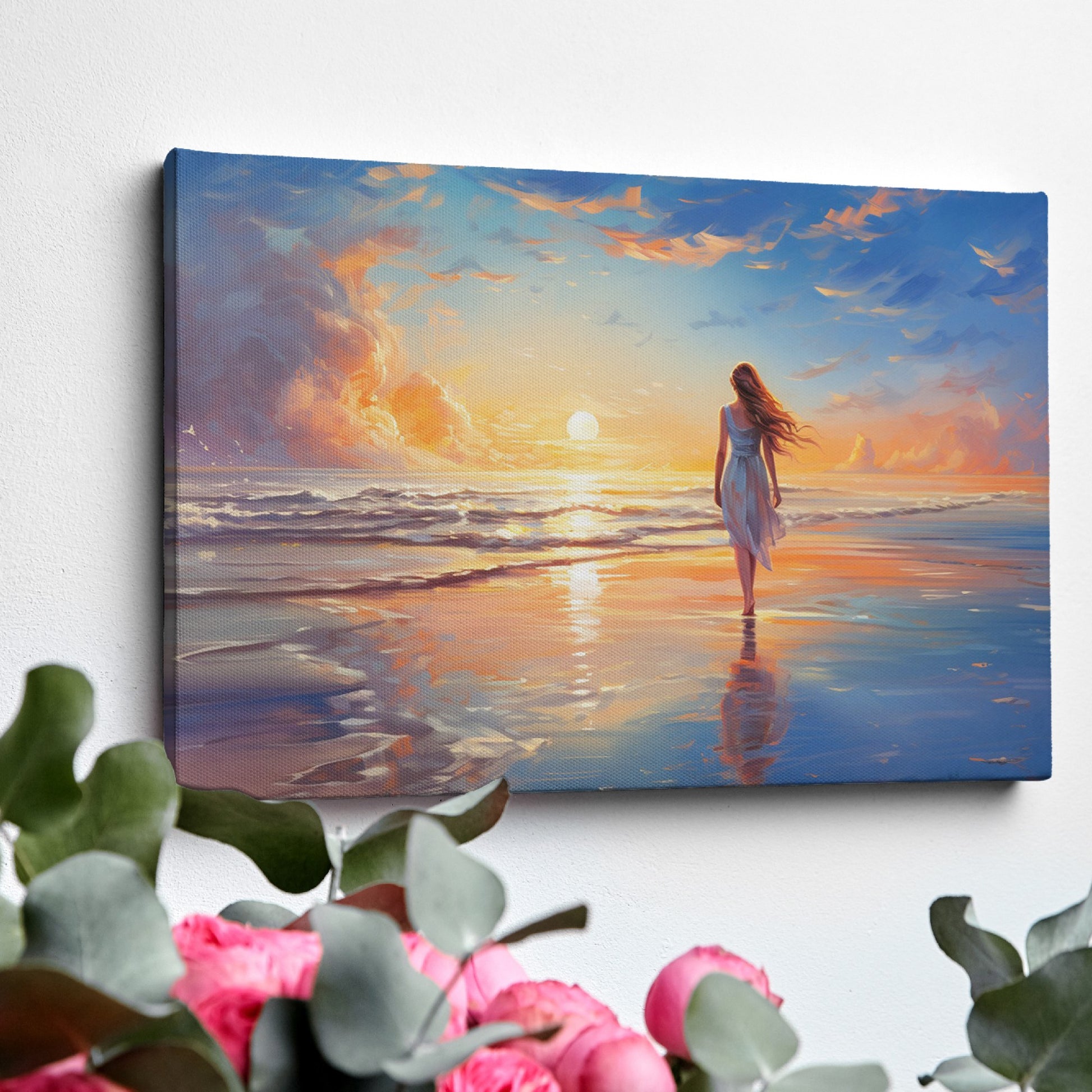 Framed canvas print of a woman walking on the beach at sunset with vibrant skies reflected in the water