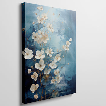 Framed canvas print of abstract blue and gold blossoms over a textured background