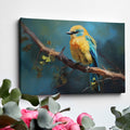 Framed canvas print of a vibrant blue and yellow bird perched on a tree branch with green leaves