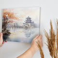 Framed canvas print depicting an autumnal Oriental scene with a pagoda and misty lake