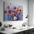 Framed canvas print of vibrant impasto floral artwork in purple, orange, and blue tones