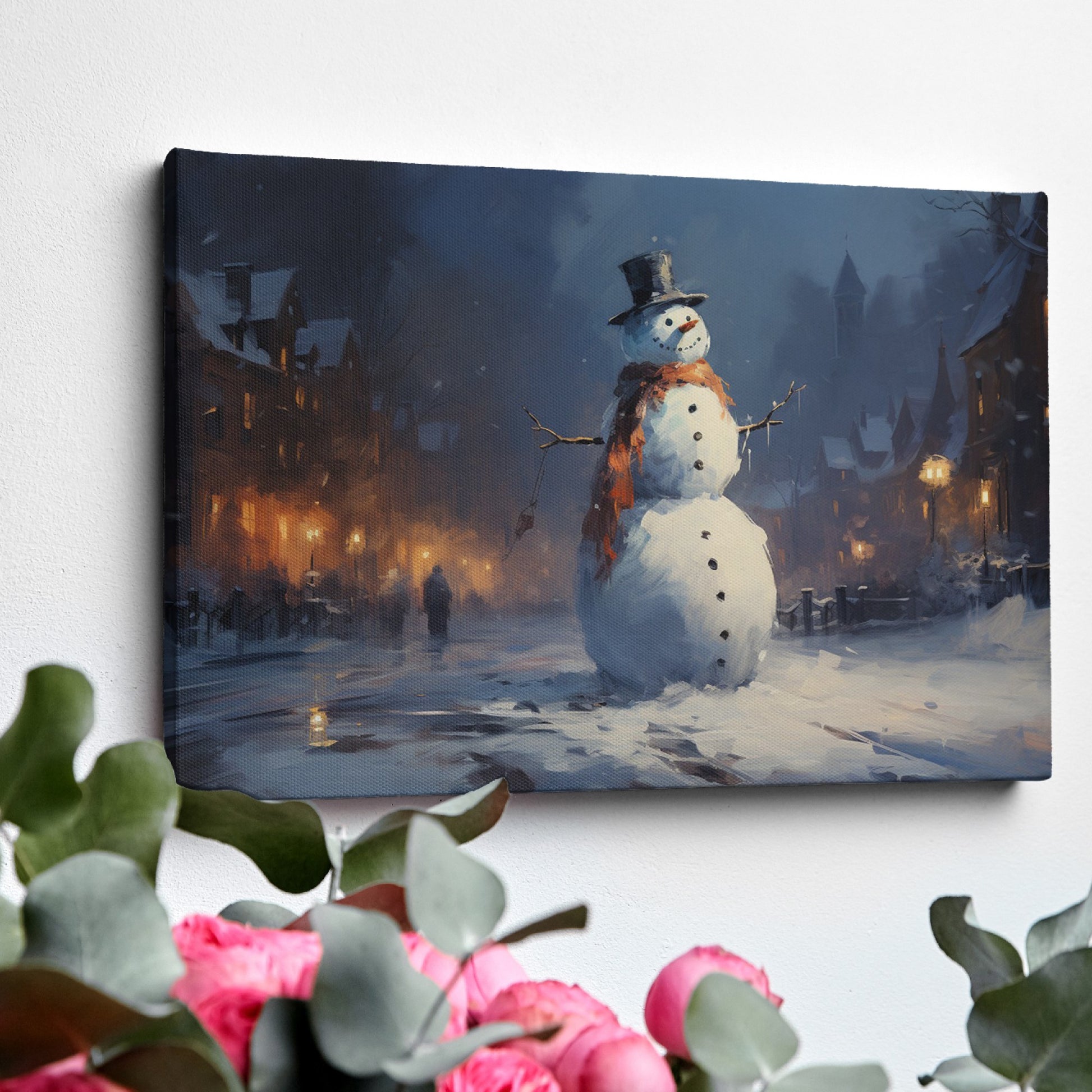 Framed canvas print of a snowman in a winter evening townscape with warm street lights and snowfall