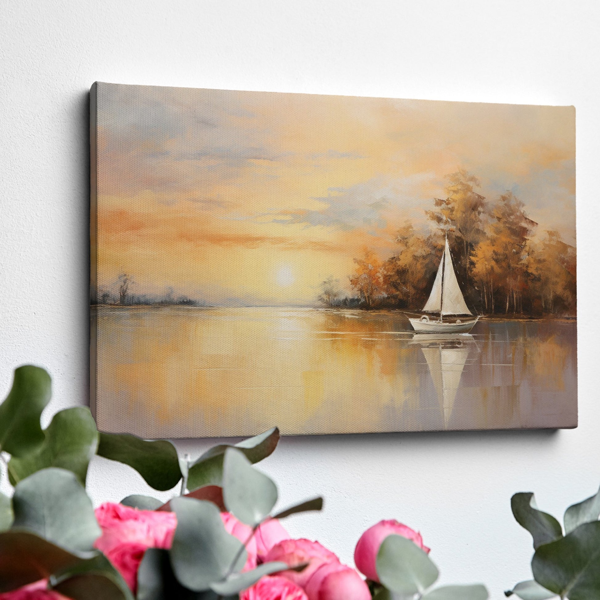 Framed canvas print of a sailboat during sunset with golden sky and water reflections