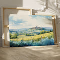 Framed canvas print of a Tuscan landscape with watercolor rolling hills and a village